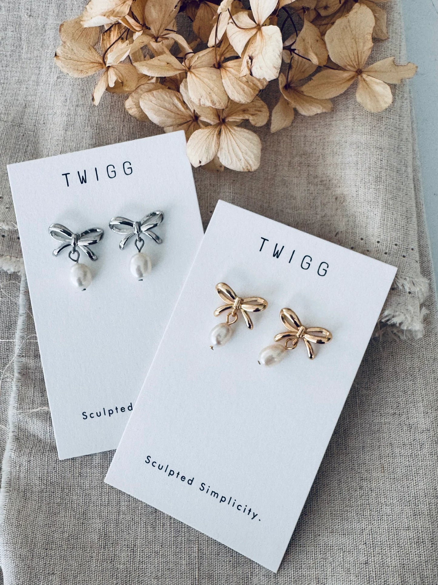 TWIGG JEWELLERY Bow Pearl Studs